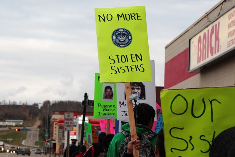 A crowd navigates its way through downtown Athabasca on Oct. 4 for the annual Sisters in Spirit vigil, which is part of a national movement to draw attention to missing and