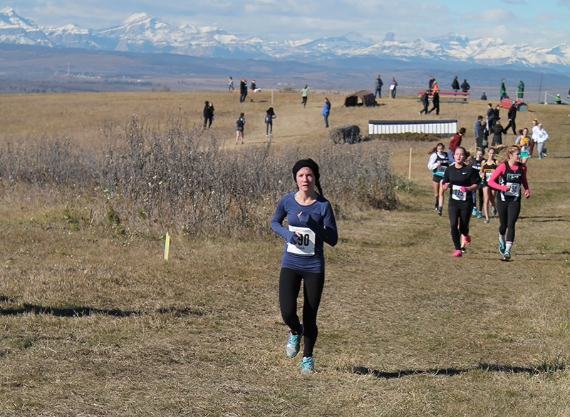 Boyle School&#8217;s Emma Sachko paces herself during the junior girls provincial cross country race, a three-kilometre trek.