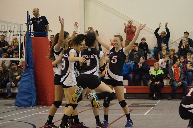 The Boyle School girls volleyball team celebrates after scoring a point on tournament hosts, the Senator Gershaw Gators, on Nov. 26.