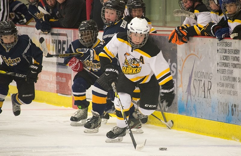 Athabasca Hawk Lochlan Hefferan flies down the ice on a breakaway as the Edson Eagles make a line change during the first game on Dec. 30 at the Multiplex.