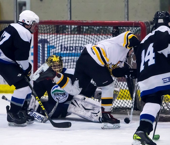 Hawks Pee Wee Noah White rushes the Hinton Havoc&#146;s end in a game at the Athabasca Multiplex on Jan. 7. White got two of the Hawks&#146; seven goals.