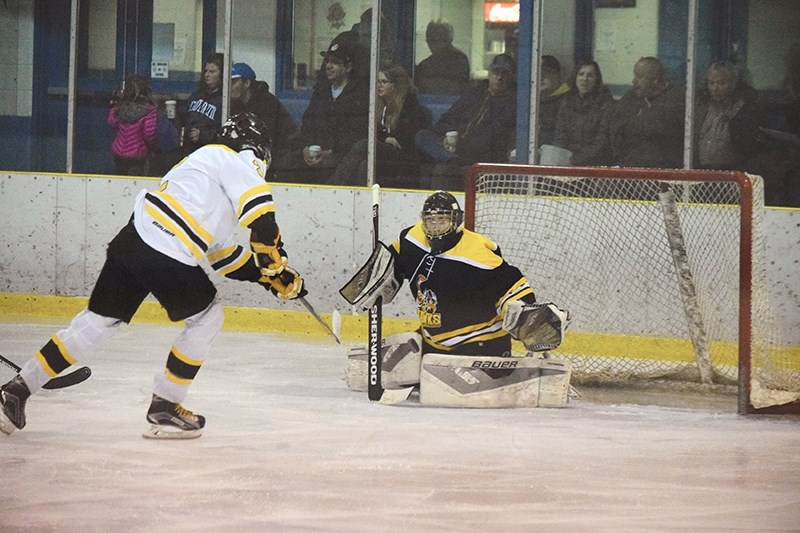 Hawks goaltender Brady Bilsky blanks Steeler Nicolas Botros on a close in chance on Jan. 15. The Hawks and the Steelers ended the game in a 3-3 tie.