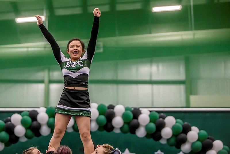 Wyeth Tan, cheerleader with the EPC junior cheer team, is held up in the air during her team&#146;s routine.
