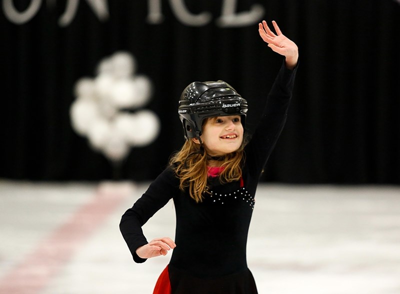 Katherine Adams waves to the crowd after her performance.