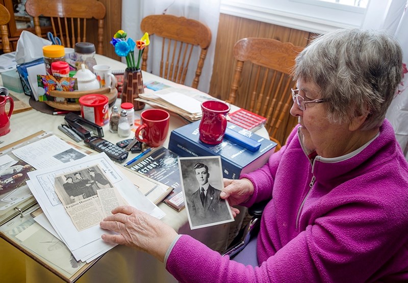 Ardith Haub, daughter of Vimy Veteran Walter Peters, holds a photo of her father as a young man.