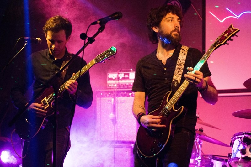 Elden Borgen and Richard Nolan of Peripheral Visionary play during the battle of the bands at Neighbors Pub May