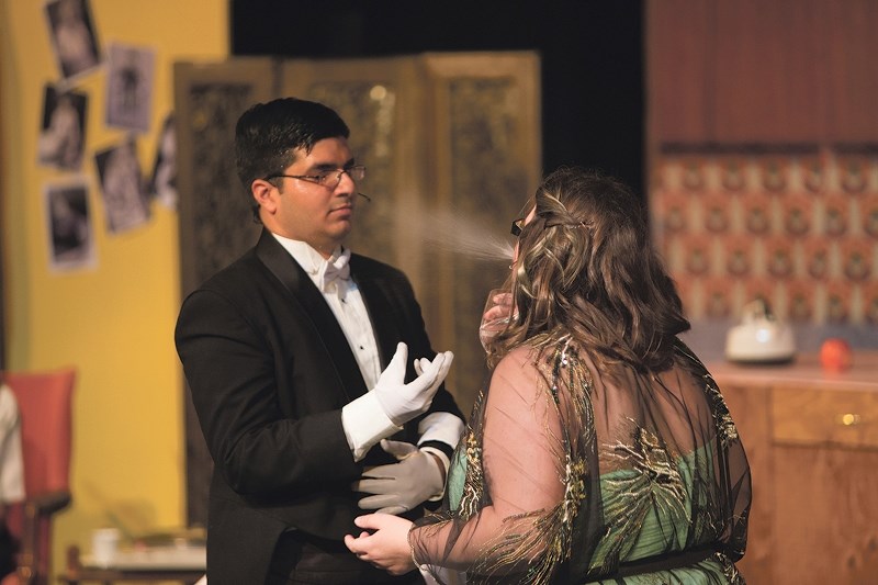 Expecting ice water and finding vodka, elderly Mrs. Tottendale (Heather Seefried) spits on her manservant Underling (Victor Kaisar).
