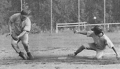 Athabasca Angels&#146; Shane Czwil slides into third base as the Sturgeon Paladin third base man misses the ball on July 14, 2004. The Angels were Athabasca&#146;s last team