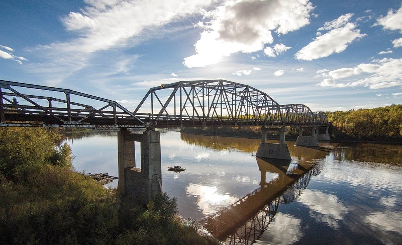 Alberta Transportation is asking local municipalities to pay for utility capabilities across the new Highway 813 bridge across the Athabasca River, and for a portion of the