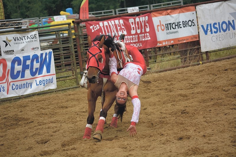 Katie Connolley performs a trick on her horse.