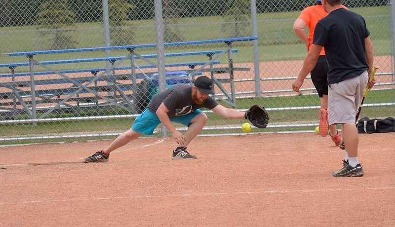 Liam Graling of team Pin Point Point Locating reaches for the ball while playing team Cheap Seat Sporting Goods at the Athabasca Regional Multiplex Sept. 2.