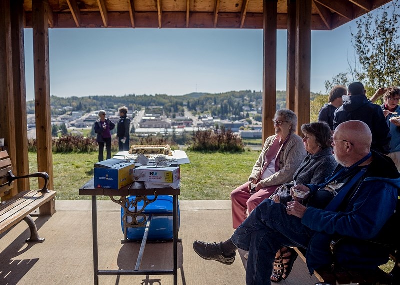 Bruce Jackson, Marion Kadikoff and Cecil Lewis sit in the gazebo at the Lions Centennial Park Sept. 17 during a Lions Club barbecue, celebrating the club&#8217;s