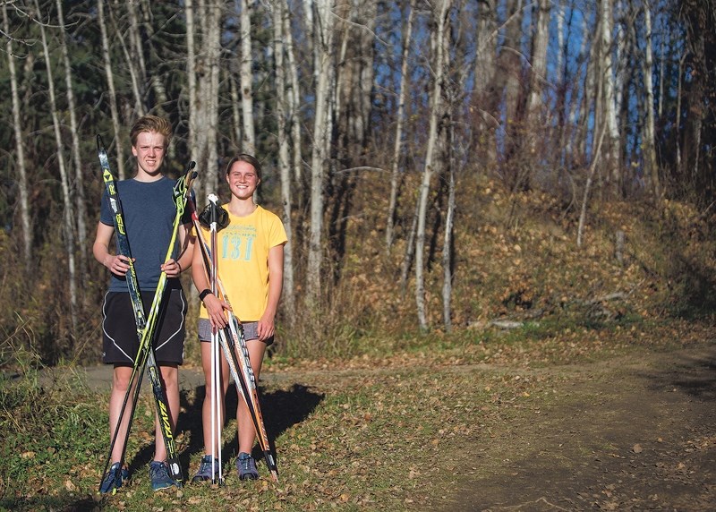 Jake Gerritse and Makayla, Cross Country Alberta, Alberta Development Team members for 2017-2018 stand in the Muskeg Creek Trails Oct. 5 after strength training.