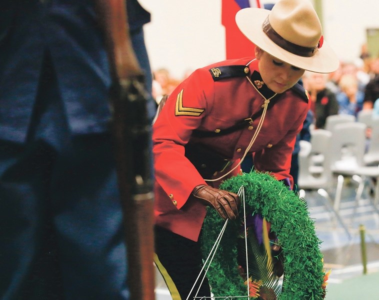 Cpl. Joanna Patry, pictured here laying a wreath at the November 2015 Remembrance Day ceremony in Athabasca, is moving to Edmonton.