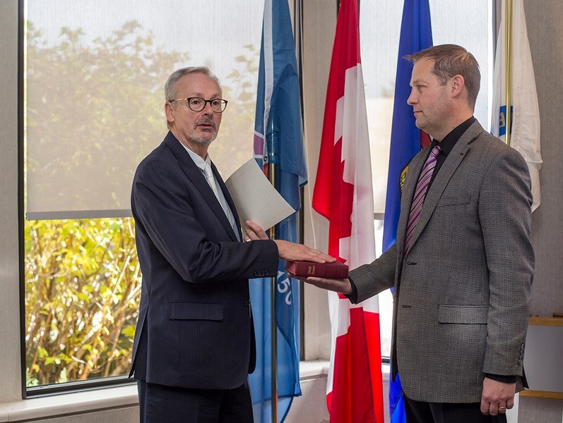 Dennis MacNeil is sworn in as Aspen View Public Schools Division trustee Oct. 20 in the Athabasca Couty council chambers. He was also nominated to retain his seat as board