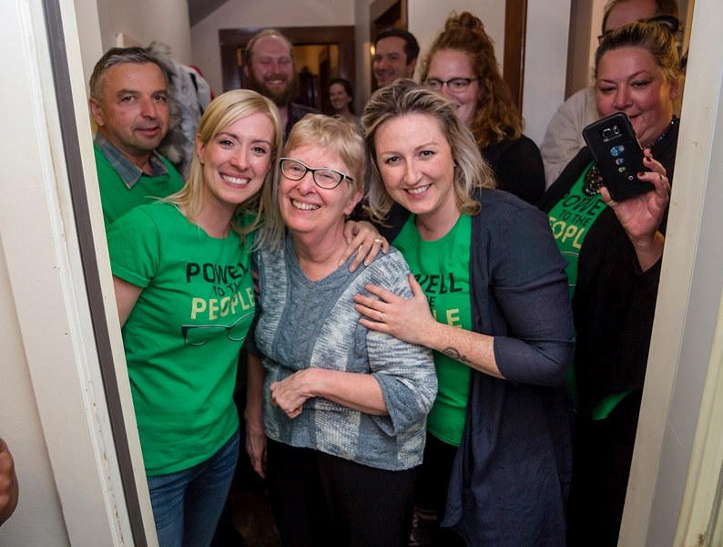 When Colleen Powell (centre) opened her door after polls closed Oct. 19, she received the news that she would be the Town of Athabasca&#8217;s next mayor. She stood among