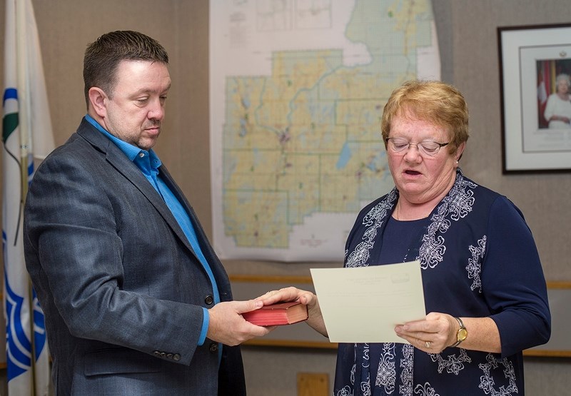 Doris Splane is sworn in for the 2013-2017 Athabasca County council term during council&#8217;s Oct. 30 organizational meeting. Warren Griffin was elected by council to serve 