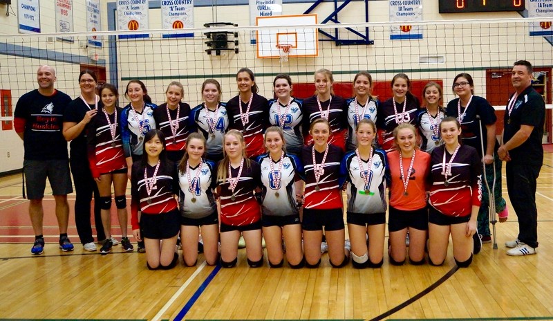The Boyle School senior girls volleyball team gathers after earning silver medals at its home tournament on Nov. 4.