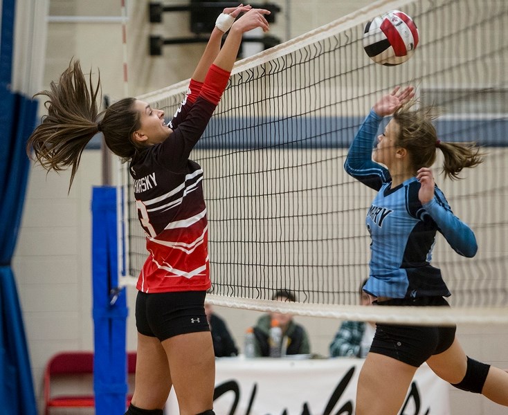 Captain Shelby Bencharsky blocks an attempt by the Westlock St. Mary Sharks in round-robin play during the Boyle School Redeye tournament.