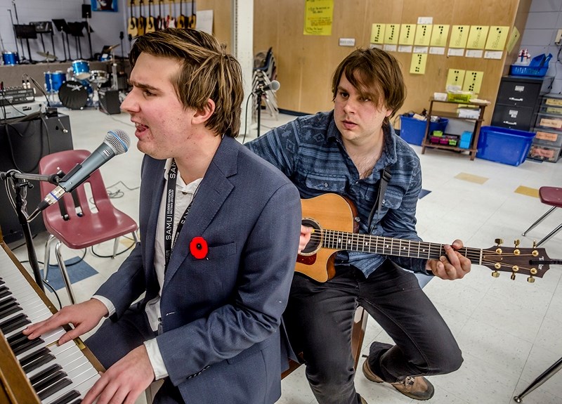 Greg (left) and Andrew Tkach of The Gear Sebastian practice music from their soon-to-be-release album Paint Nov. 9 in the Landing Trail Intermediate School music room.