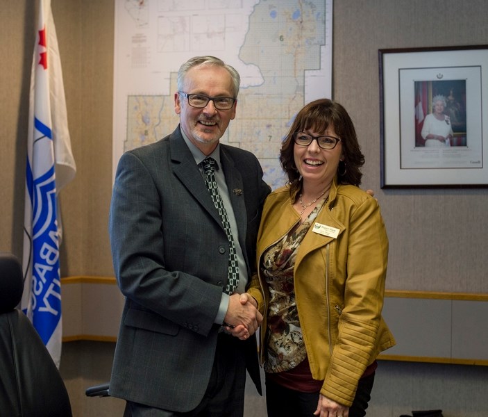 Aspen View Public Schools board of trustees chair Dennis MacNeil was presented with a pin from the Alberta School Boards Association by vice chair Candy Nikipelo Nov. 23. The 