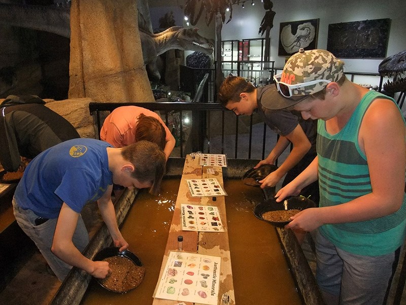 Boyle School students examine minerals at the Royal Tyrell Museum in Drumheller during a class trip in June 2017. This year&#8217;s class is holding a used good drive to