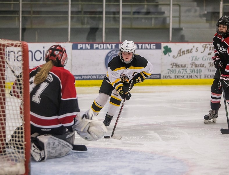 Hawks captain Jenna Kociuba makes a break away for the Warburg Wolves net in a Jan. 6 home game. The Hawks fell to the Wolves 11-1.