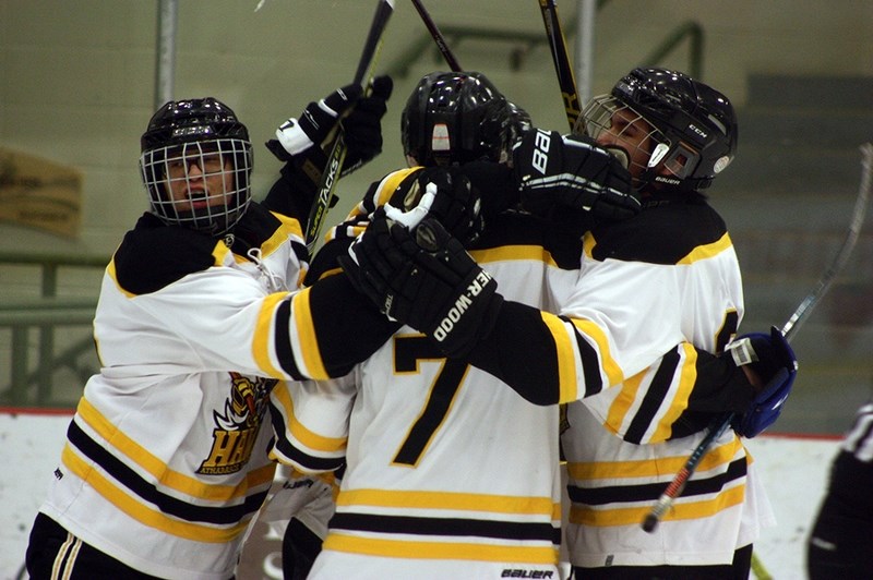 The Athabasca Midget Hawks celebrate after scoring the fifth goal in a 5-3 win at home over Vegreville Jan. 12.
