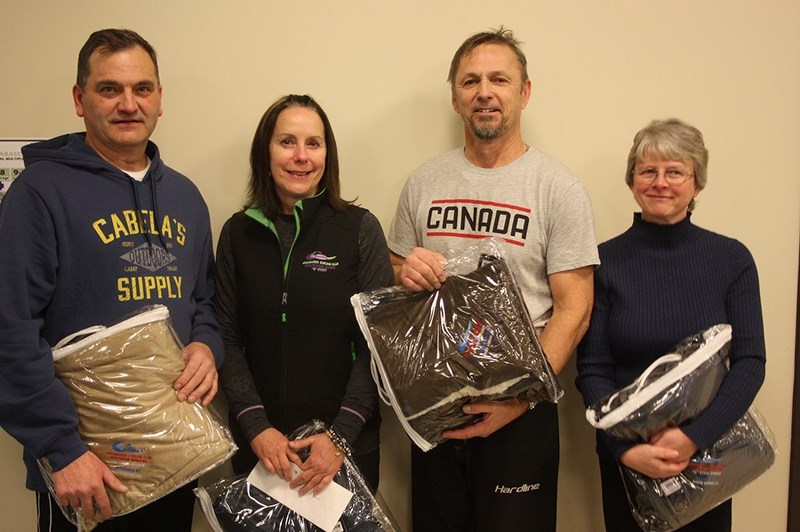 The Weber team celebrates its victory in the &#147;A&#148; final of the annual Athabasca Curling Club Society&#146;s mixed bonspiel Jan. 14. (L-R) Mike Weber, Cindy Weber,