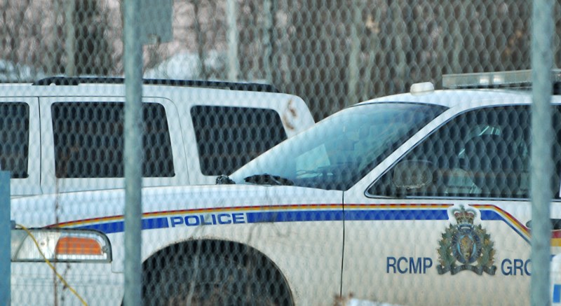 An overnight manhunt in northern Athabasca County ended with local police negotiating for the surrender of an allegedly armed man, who was suspected of breaking into