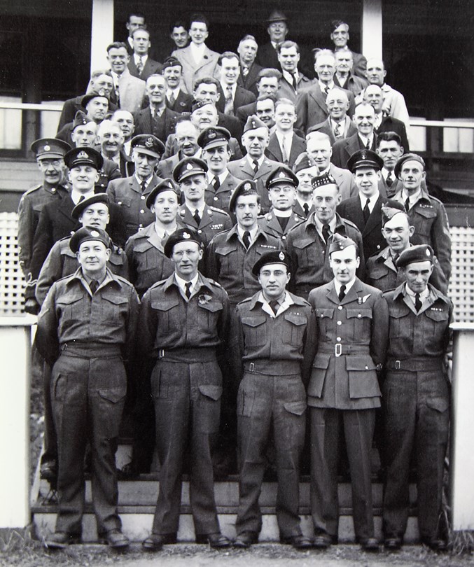  Nick Evasiuk (front row, centre) stands with a military unit. Dated 1948, it is thought to have been taken in Canada.