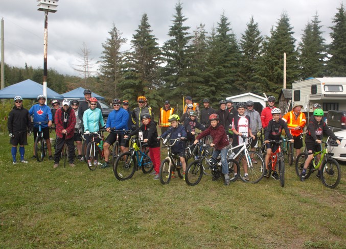  Bike riders gather before the 12th annual Williams-Mudryk 100k for the Cross at Skeleton Lake July 14.