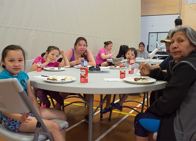  Malayla Beaver, Taya Noskiye, Gladys Beaver, Drayton Gladue, Larry Yellowknee and Dorothy Yellowknee eat lunch at the Calling Lake Recreation Centre June 1.