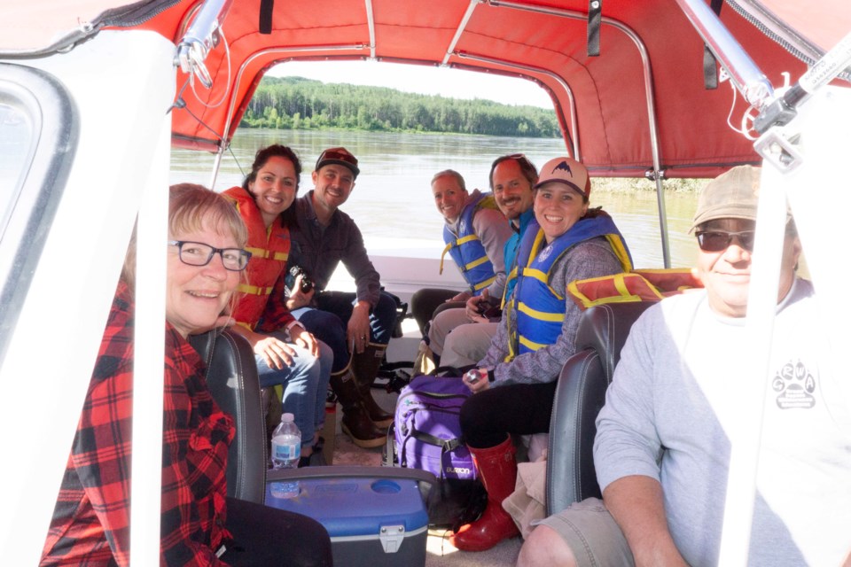  (L-R) Shirley Zelman, Sheena Garton, Brandon Boucher, Glenda Gray, Jeremy Derksen, Rachael Dragun and Darcy Zelman boarded a boat and took pictures and videos along the Athabasca River July 4 for their “Take It to the Lake” campaign.