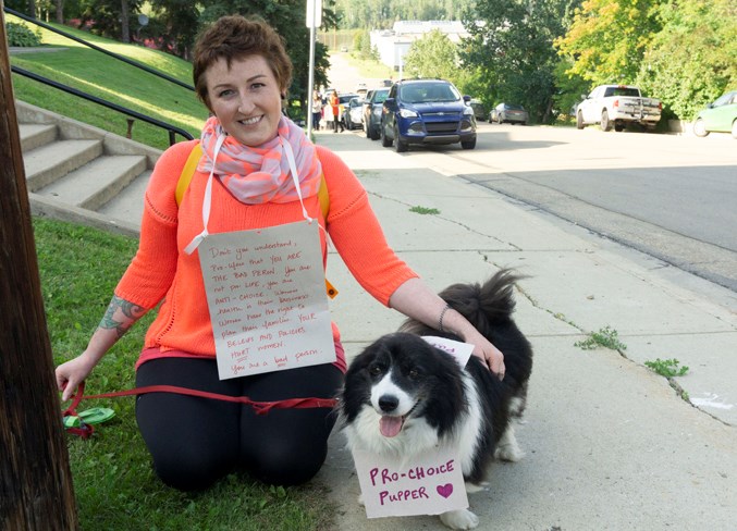  Jocelyn Loken protesting Campaign Life Coalition speaker Emily Price on July 11.