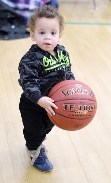 Malakai Gross, 14-months, practices his basketball skills before watching Feb. 7 Barrhead Composite Senior Gryphons home game against Westlock. Malakai was there to cheer on