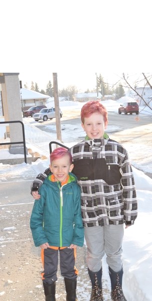 From right: Thomas, 6, and William Bain, 10, have dyed their hair pink in recognition of their participation in this year&#8217;s Hair Massacure event.