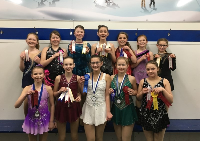 The entire Barrhead Figure Skating Club group, wearing their dress and medals, all performed well at this season&#8217;s competitions. Backleft to right-Mackenzie Bowyer,