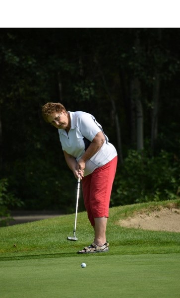 Bessie Stevens takes a put on the ninth hole at Barrhead Golf Club after returning home from the Alberta 55 Plus Summer Games in Calgary last summer.
