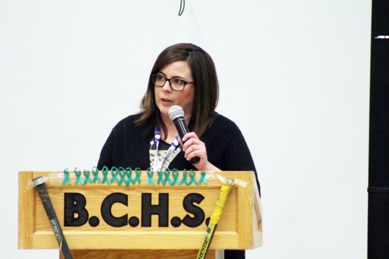 Barrhead Minor Hockey Association member Collette Weeks reads a tribute to the Humboldt Broncos on behalf of the BMHA board. Green ribbons were also handed out and pinned to