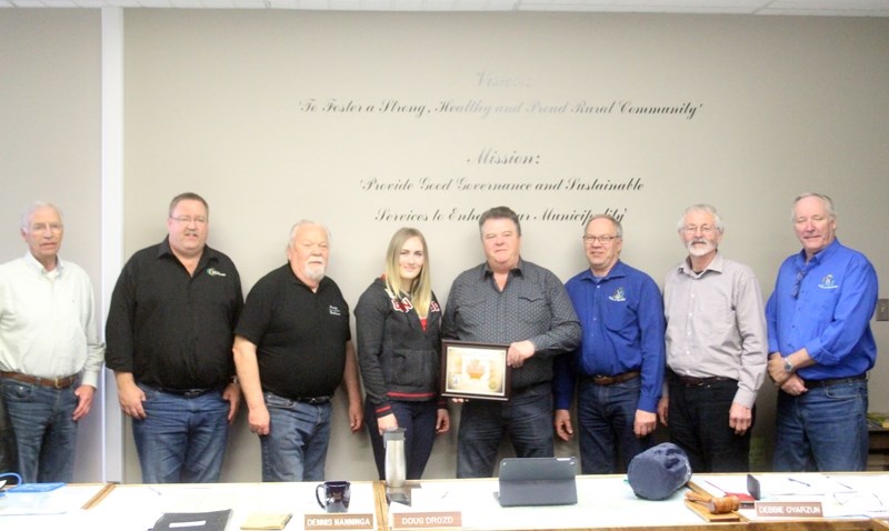 Olympic bobsledder Melissa Lotholz was honoured by County of Barrhead council with a commemorative plaque and posed for a photo on April 17. Pictured here include Deputy