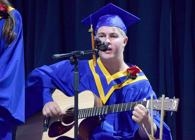 Daniel Schiller performing Good Riddance as part of the graduation choir.