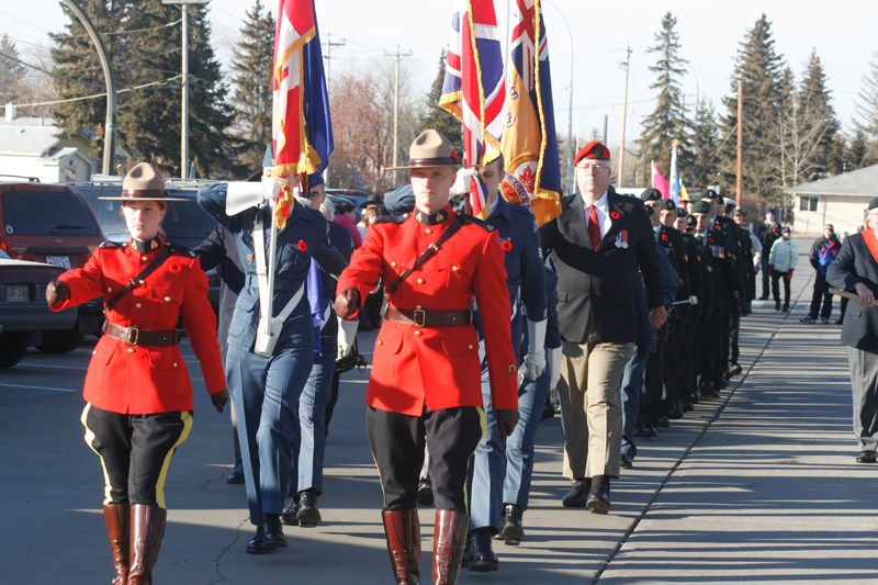More than 100 veterans, police officers, cadets and members of the First Mechanized Brigage Group Headquarters, Signals Squadron, Canadian Forces Base Edmonton, marched in
