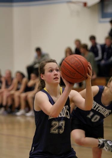 Jaclyn Fischer prepares for a free throw during the community fundraising basketball game for Heidi Peters Dec. 23 at BCHS.