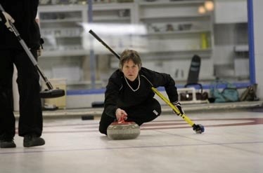 Veronica Properzi throws her final stone of the end against Jina Greilach&#8217;s rink Friday night during the ladies bonspiel.