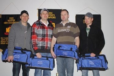 &#8216;A&#8217; Event champions (L-R), Tim Sweeney, Greg Sweeney, Alan Sweeney and Ryer Atkinson with their championship bags after defeating Cam Ray&#8217;s rink 3-2.