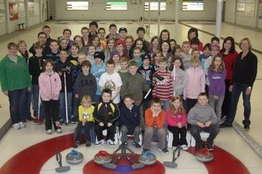 The Little Rocks and Junior Curling Program members get together for a group photo at the end of the 2011-12 season, which culminated with a pizza party and awards night on