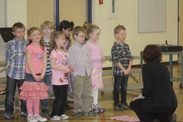 Barrhead Elementary School Grade 1 students receive some last-minute instruction before performing last Wednesday at the BES gym.