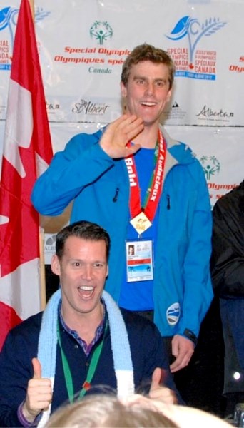 Barrhead&#8217;s Tyler Chapman celebrates his gold medal win with Mark Tewksbury. Chapman won the the 111-metre speedskating event at the Special Olympics Canada Winter Games.