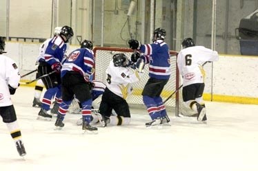 Spencer Voight and Brett Bujold battle with Rangers defenders as they try to put the puck into the net. Thursday was an evening of frustration for the Steelers as their